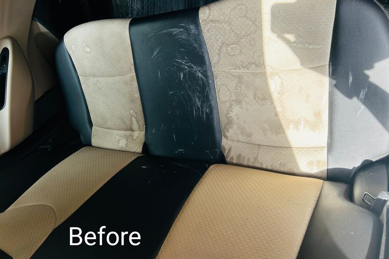 Before interior detailing — stained rear bench seat