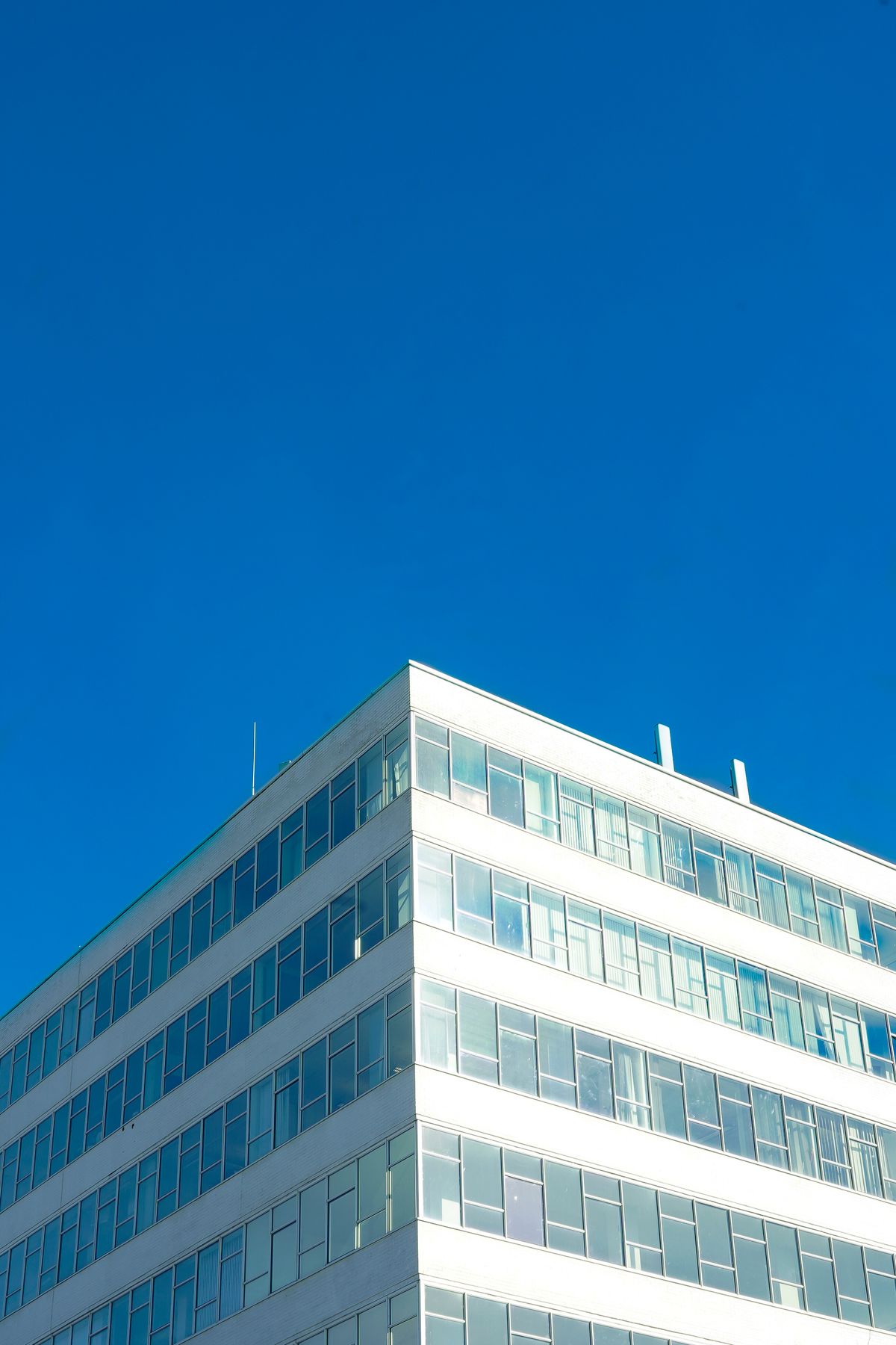 Before film installation — clear, untinted office building glass facade