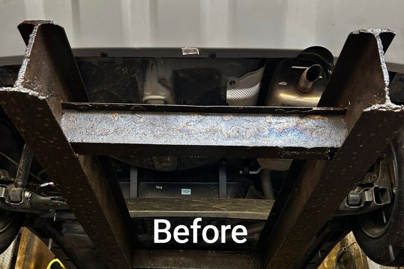 Corroded underbody chassis before anti-rust treatment